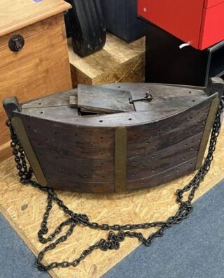 “Thrift store find: made of hardwood, features a solid iron chain and brass plates, hollow inside. Any thoughts?
