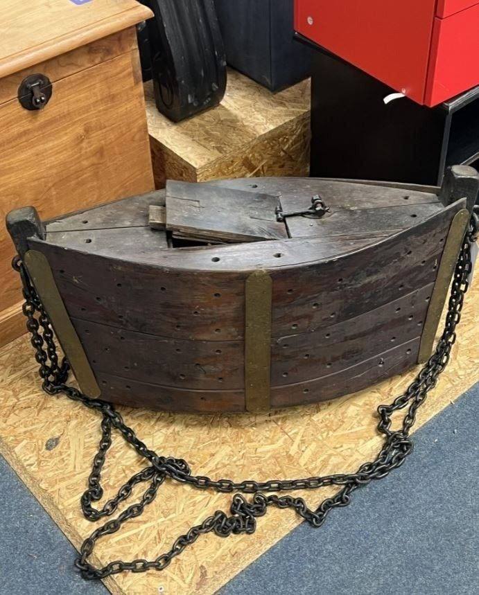 “Thrift store find: made of hardwood, features a solid iron chain and brass plates, hollow inside. Any thoughts?